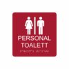 Röd och vit skylt för personaltoalett med piktogram av en kvinna och en man åtskilda av ett lodrätt streck, texten personal toalett står under symbolen och punktskrift längst ned