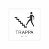 Vit och svart skylt för trappa med piktogram av en person som går uppför en trappa, texten trappa  står under symbolen och punktskrift längst ned