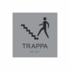 Silvergrå och svart skylt för trappa med piktogram av en person som går uppför en trappa, texten trappa står under symbolen och punktskrift längst ned