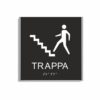 Svart och vit skylt för trappa i storlek 150 x 150 mm med en tunn aluminiumram, med piktogram av en person som går uppför en trappa, texten trappa står under symbolen och punktskrift längst ned